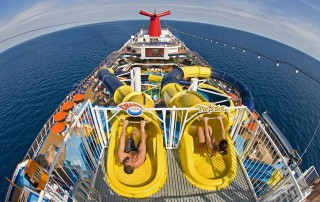 Guests slide down two massive corkscrew waterslides featured within the Carnival Dreams expansive WaterWorks attraction, the most elaborate water park at sea. FOR EDITORIAL USE ONLY (Photo by Andy Newman/Carnival Cruise Lines/HO